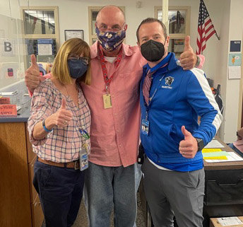 Monticello teacher John Maranzana, center, poses with building principal Stephen Wilder, left, and guidance counselor Sheryl Manz. "We sent it to a colleague who was out ill," said Marazana. "It kind of shows the COVID mask culture we live with and the thumbs-up for optimism."